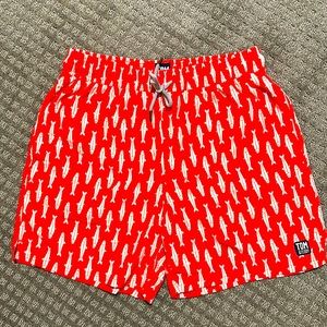 Tom and Teddy size medium swim shorts with inner liner. New with tags.
